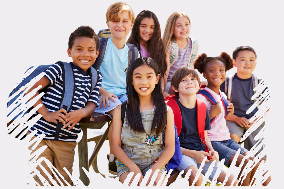 Eight children wearing backpacks smiling